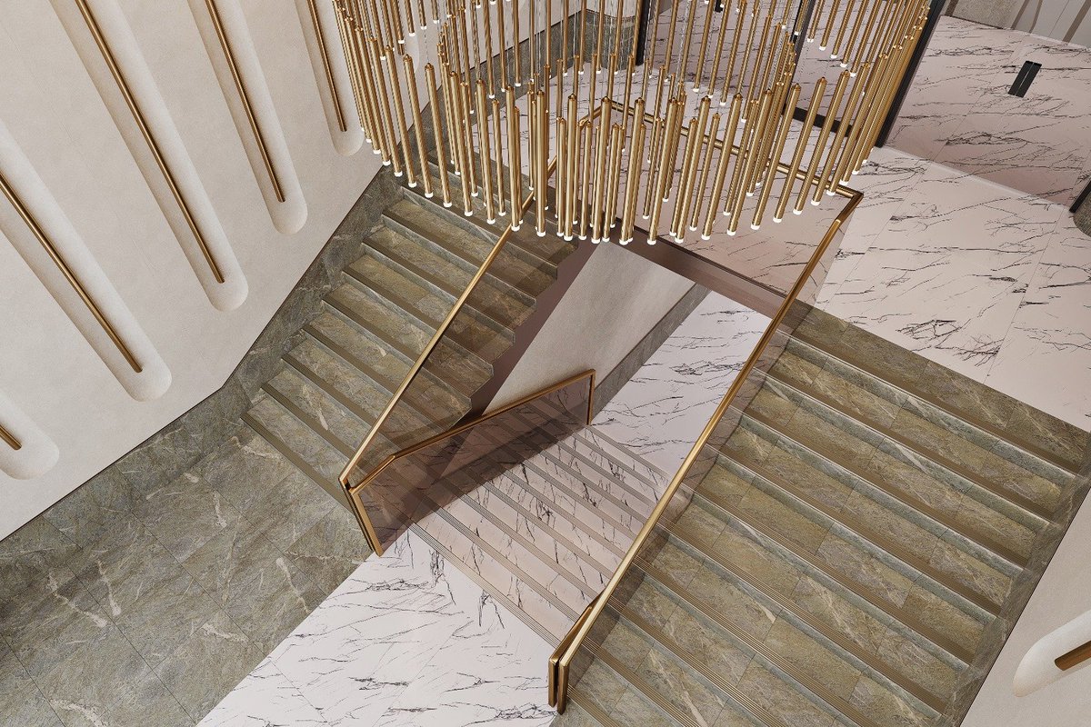 CSTERNDesign1's tweet photo. Grand yet grounded — this sculptural staircase welcomes with timeless symmetry and quiet luxury. Rich green stone steps and golden vertical accents guide the eye upward to the showstopping chandelier, a contemporary cascade of warm brass and light.

Monumental, refined, and designed to impress at every level.

#luxuryinterior #grandentrance #staircasedesign #modernclassic #interiorinspiration #brassdetails #marbleflooring #highenddesign #interiorcomposition #hotelinterior #lobbygoals #designstatement #refinedaesthetics #lightingdesign #contemporaryelegance