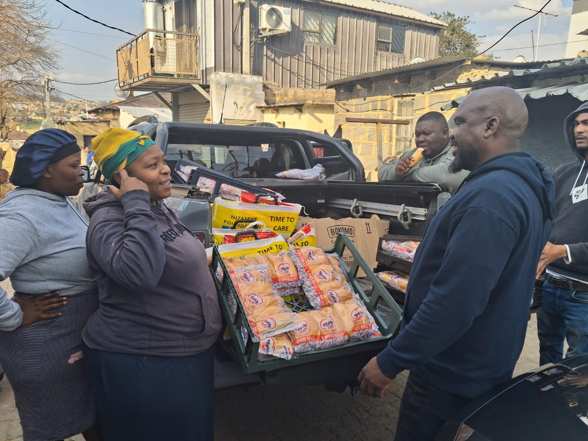 TimeToCareSA's tweet photo. Food hampers and bread distribution in Alexandra woth Adolph Marema #charity #support #communityimpact #CommunitySupport  #Care https://t.co/2PJhdGBJTh