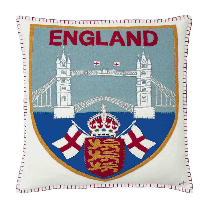 New - England Travel Badge Cushion - Inspired by vintage travel emblems, this handcrafted piece showcases iconic symbols of England. janconstantine.com/england-travel…