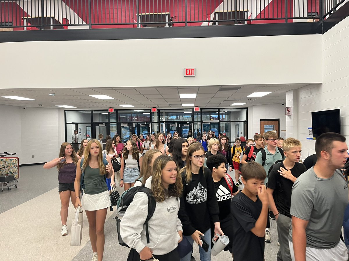 Buses rolling and students entering the new Milford Middle School.