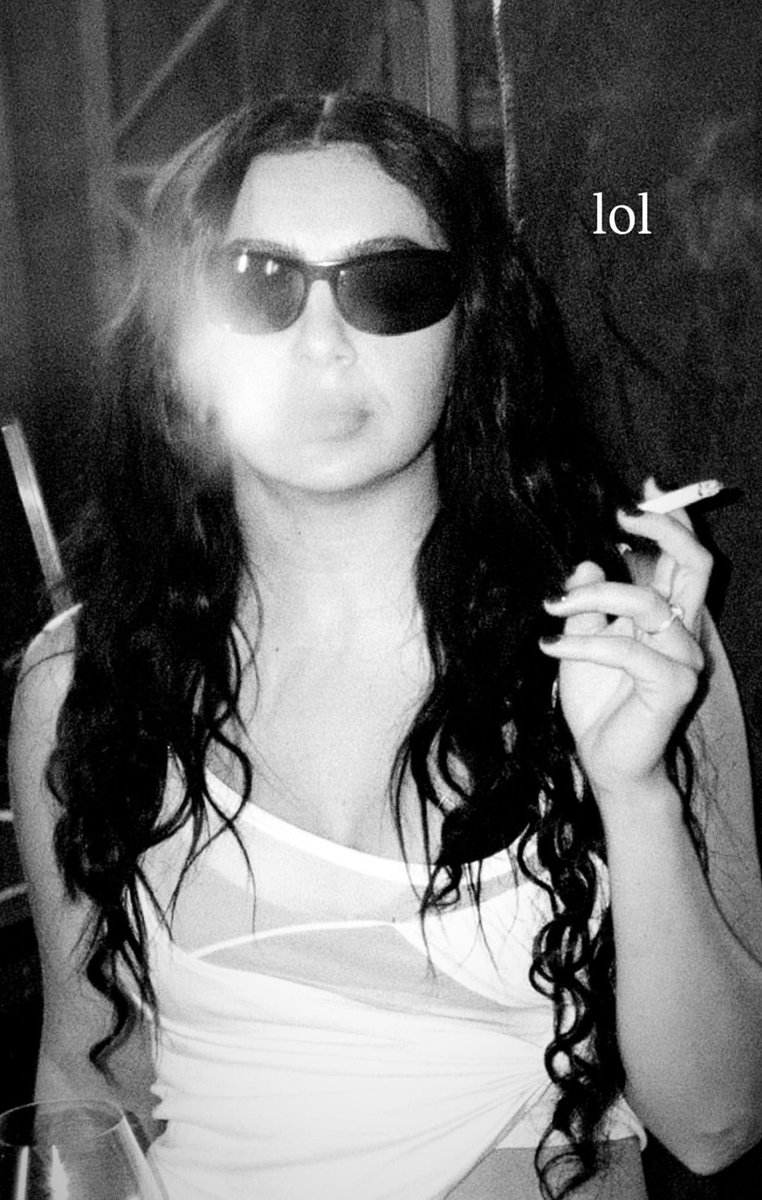 charli xcx smoking cigarettes Charli xcx stuns while smoking a cigarette. 🖤