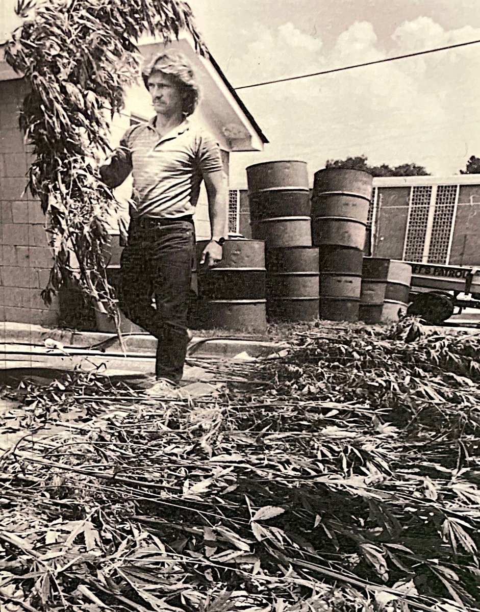 RCSD's tweet photo. ⏳It's #WayBackWednsday⏳

Check out Lt. Lott in the 1980s!  Here he is pictured at 1400 Huger Street, the old RCSD Headquarters, with marijuana   plants seized from the Lower Richland area.

Not sure which is more flowy....Lt. Lott's luscious locks or the pot plants! 

#TeamRCSD https://t.co/MtTOcgIQ4b