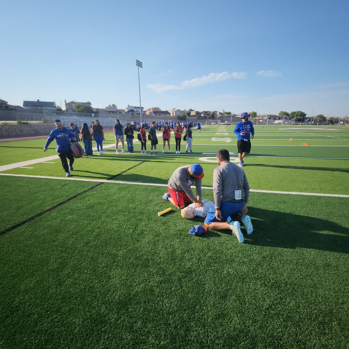 ahstrainers17's tweet photo. Day 3. Medical Prep, DONE! Student Athletic Trainers Aides &amp; ALL our football coaches practicing reviewing CPR and our @Coach_NoeRobles coaches completing CPR mock emergency drill! LETS GO!!  EMS : Preparing/practicing / implementing / better @BlazerNationAHS @Americas_HS https://t.co/w4wUH0nQwY
