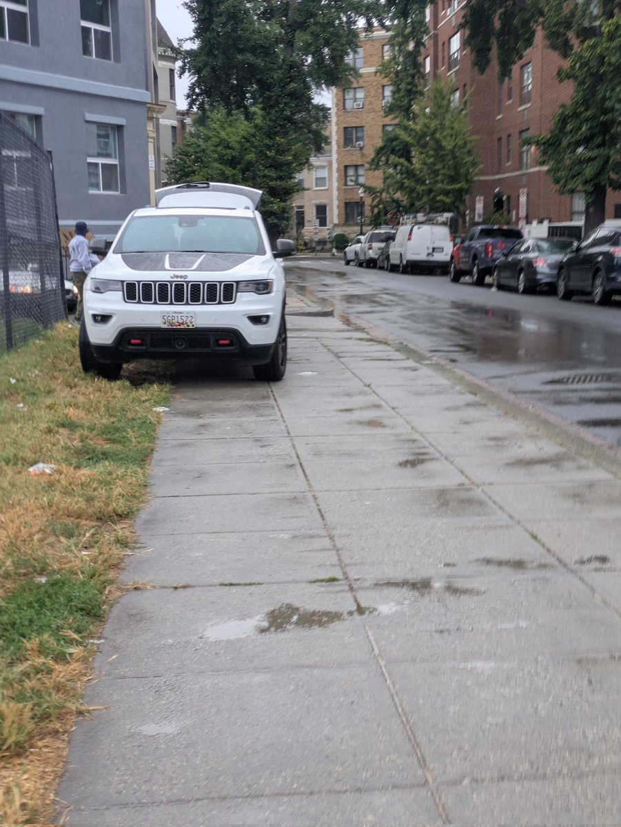 SUV parked illegally on the sidewalk Hiatt Place NW between Irving Street NW and Park Rd NW <a href="/311DCgov/">DC311</a>