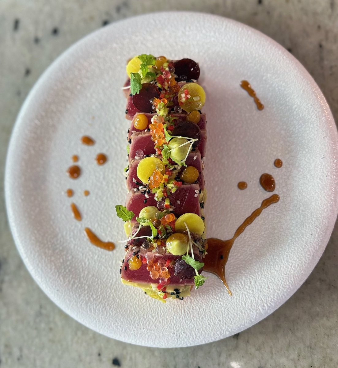 ChefLevShow's tweet photo. Tuna Tataki, But Make It Art 🔥

Sesame-crusted tuna draped in truffle soy emulsion, topped with yuzu &amp; salmon roe. Ponzu gel, ponzu dice, pickled Japanese radish, avocado, mango gel, guacamole on crisp baguette.

#FineDining #TunaTataki #FoodArt #ChefLife #levchefshow https://t.co/xJjXiNJrQW