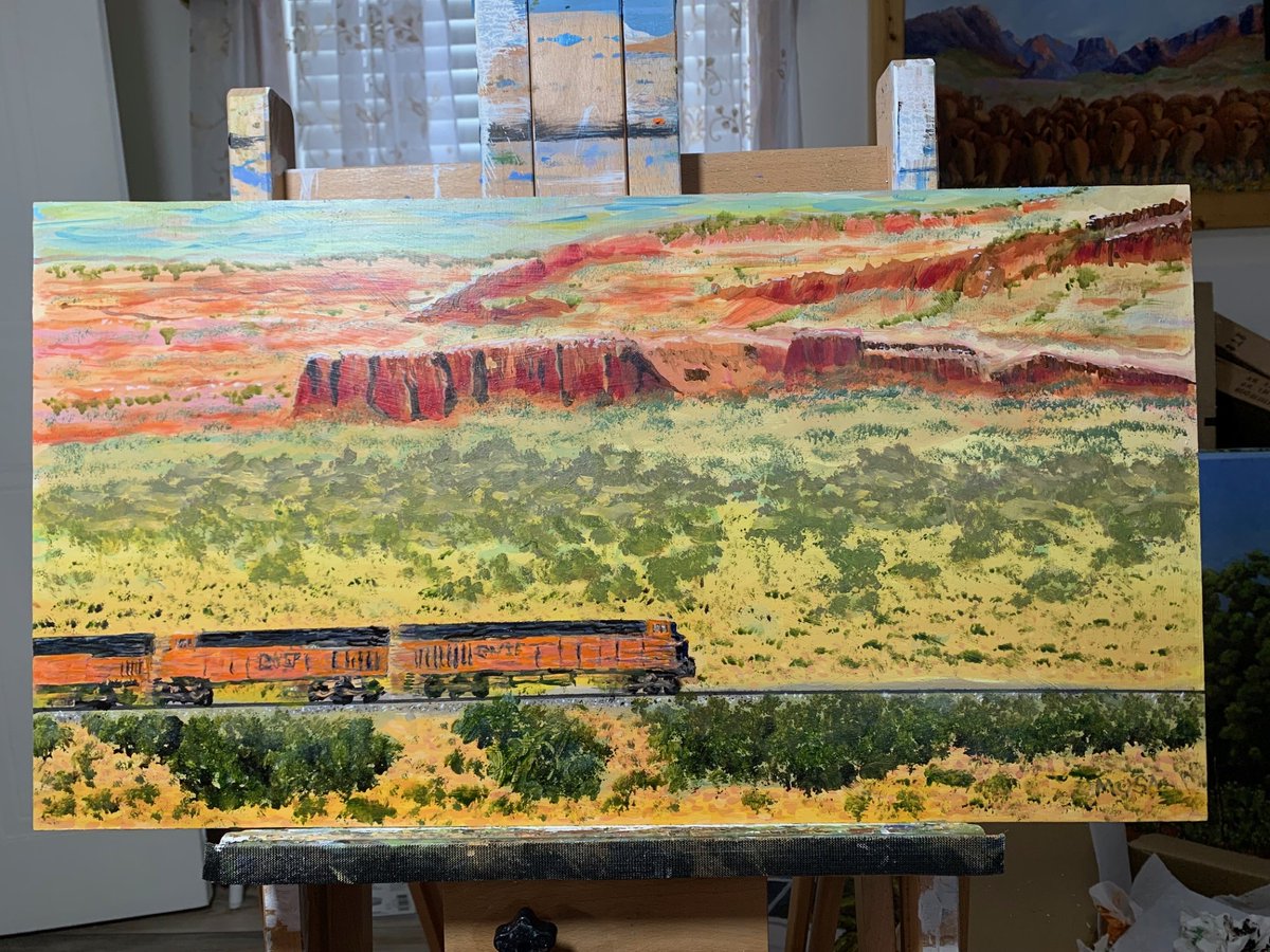 panalcesium's tweet photo. 2 oil paintings from a photo of a BNSF train crossing the desert, which someone posted on X (and now I can't can't give him credit was because my reply to him has disappeared).  Nevertheless, the more "realistic" one was painted first and I was not especially happy with it.  I much prefer the second more impressionistic one.