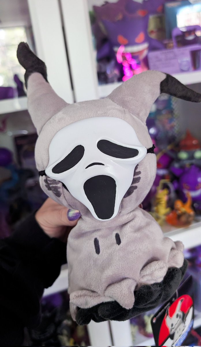 Shiny Mimikyu wearing a Pikachu costume wearing a Ghostface costume