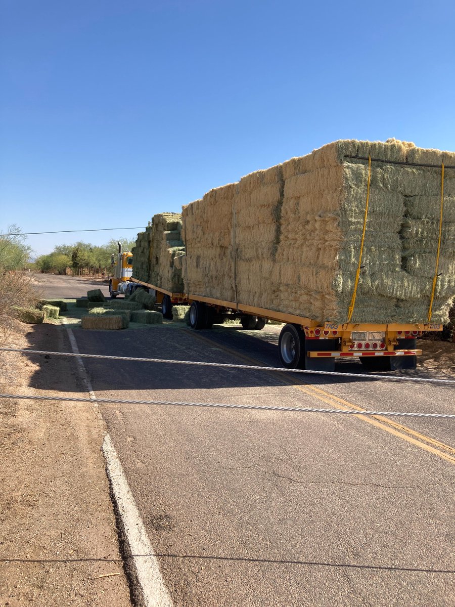 SRPconnect's tweet image. This hay truck caught overhead lines resulting in downed power poles and lines. SRP crews were able to safely and quickly restore power.
