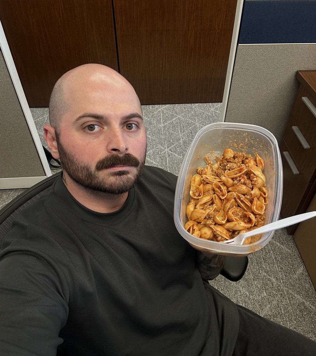 Me and the leftover pasta I ate at work today in my cubicle I am so thankful for capitalism and corporations and profit