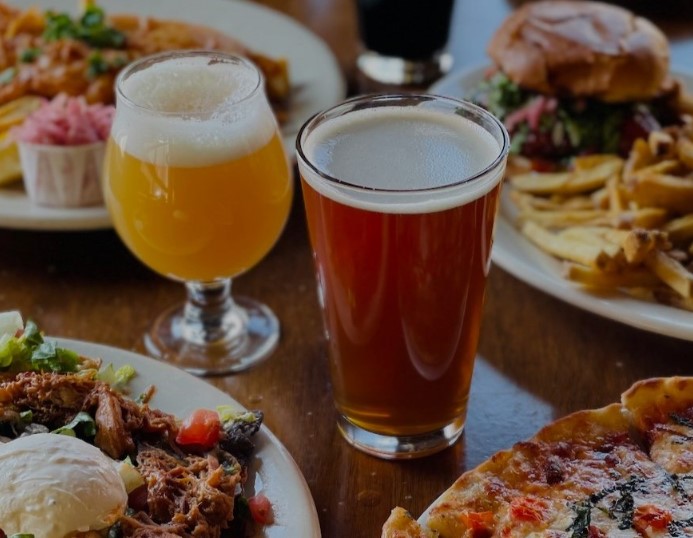 The old word "dragan" meant to carry or pull. Over time, dragan evolved into "drag," "draw," &amp; "draught" (countries like UK, Ireland, &amp; Australia still use this).

"Draft" became Americanized version, liquid being pulled or drawn from the barrel to the faucet. Now you know.