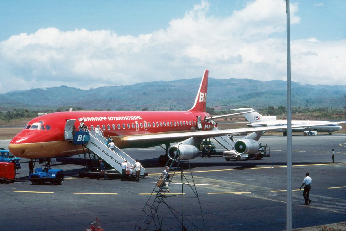 BRANIFF IN SOUTH AMERICA THE COLLECTION OF J. ESCOBAR - Braniff International McDonnell Douglas DC-8-62 Intercontinental Jet registered as N1806 is parked on the ramp at Panama City Tocumen Airport, Panama, in April 1977. The Legend of South America is painted in the 1971 Glenn