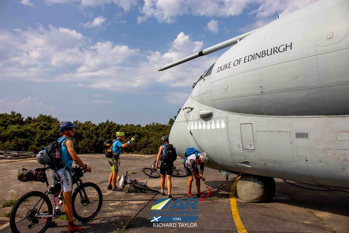 ARWorldSeries's tweet photo. At the far edge of the course, teams reached one of ITERA’s most distinctive waypoints – the imposing Nimrod aircraft, standing silent against the Highland sky.
A quick pause for a photo, a punch on the control, and they were moving again – dwarfed by the machine’s size, but every bit as relentless in their own mission.

📸 - @rich_ontheroad 

#ITERA2025 #CheckpointNimrod