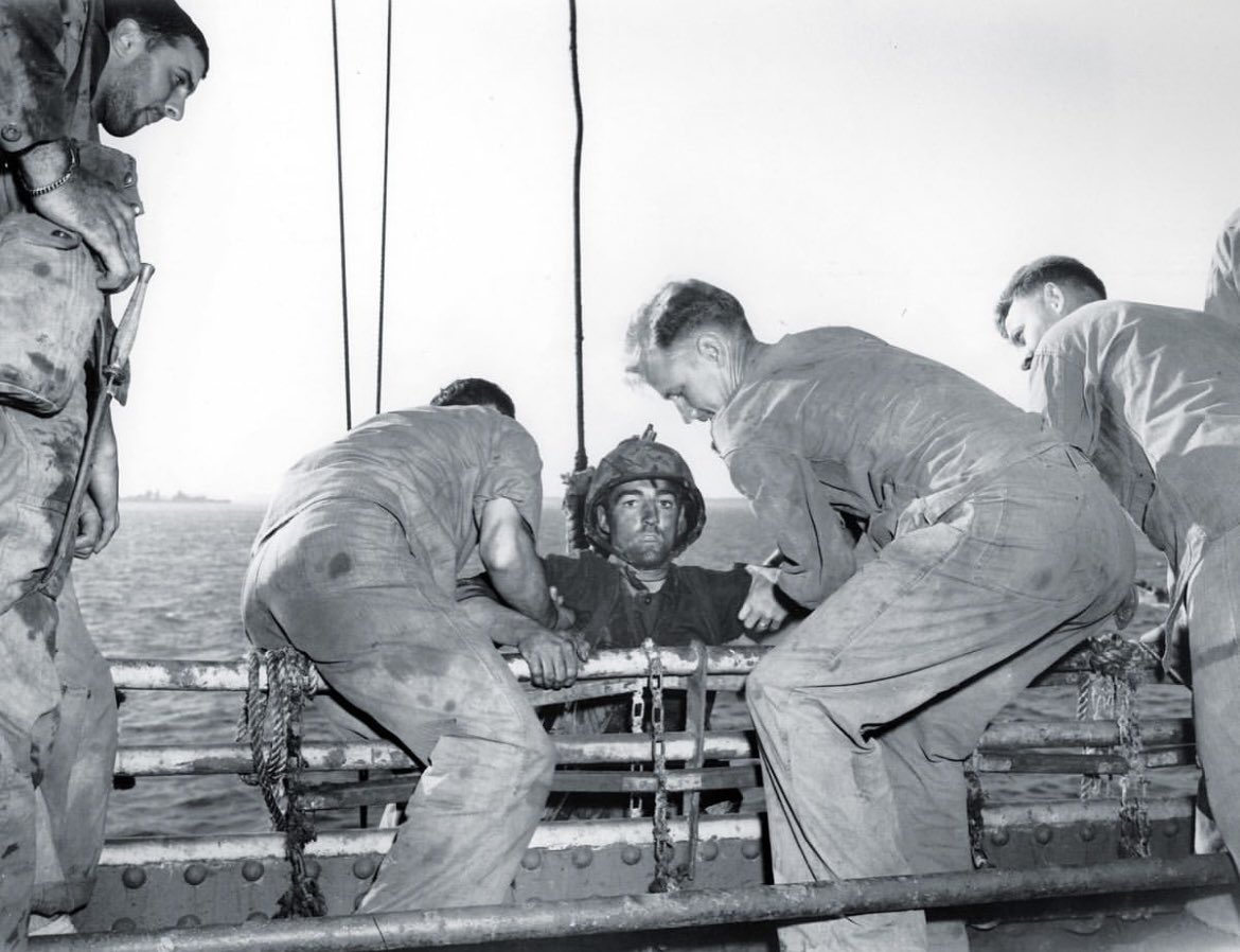 The thousand yard stare 
Theodore J. Miller (February 12, 1925 - March 24, 1944), 19, of Minneapolis, MN assisted to aboard the Arthur Middleton after two days of combat on Engebi, the first of the Eniwetok Atoll to be invaded by American forces.