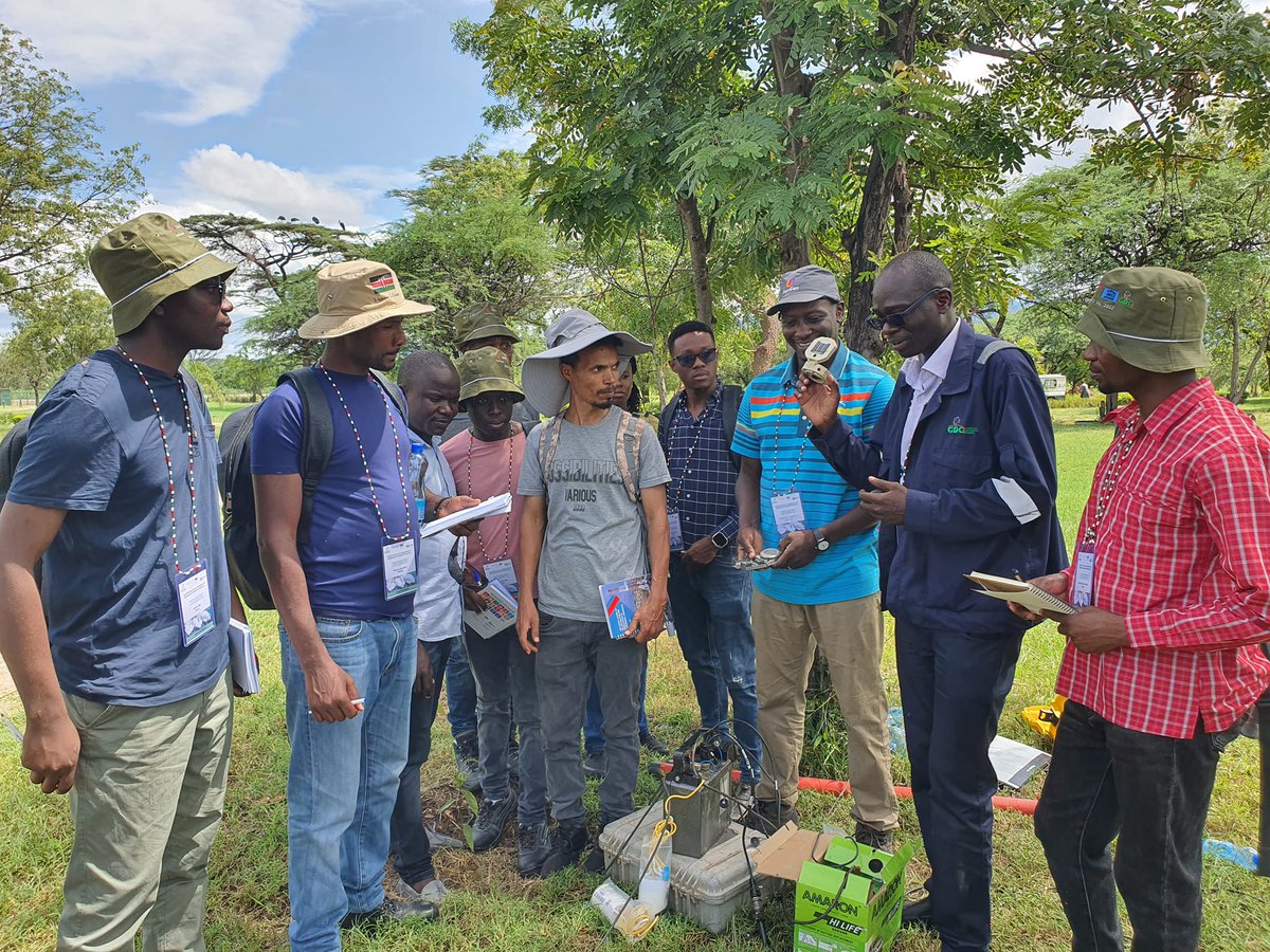 GDCKenya's tweet photo. #TBT to Nov 2023 when #TeamGDC Principal Technician Fredrick Ogada (second right) demonstrated how the Magnetotelluric (MT) method works to #GROGTPShortCourseVII participants. This technique uses natural signals from the earth to help map geothermal resources deep underground. https://t.co/ffdCnwKCHu