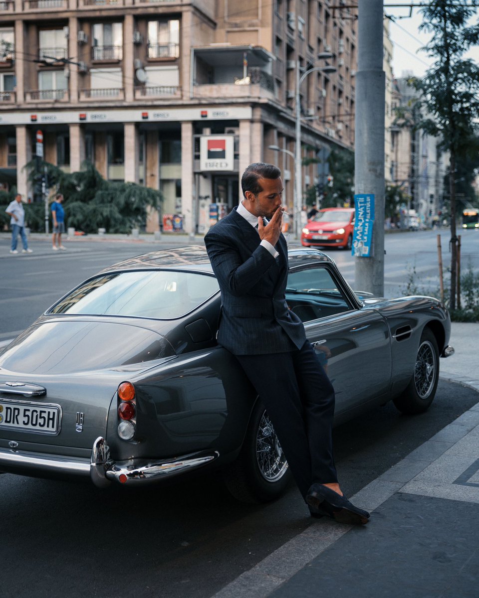 Lighting a cigarette and smoking it all while driving a manual car and changing gears and cornering should be a mandatory skill to obtain a license. 

Burn marks on the seats = fail.