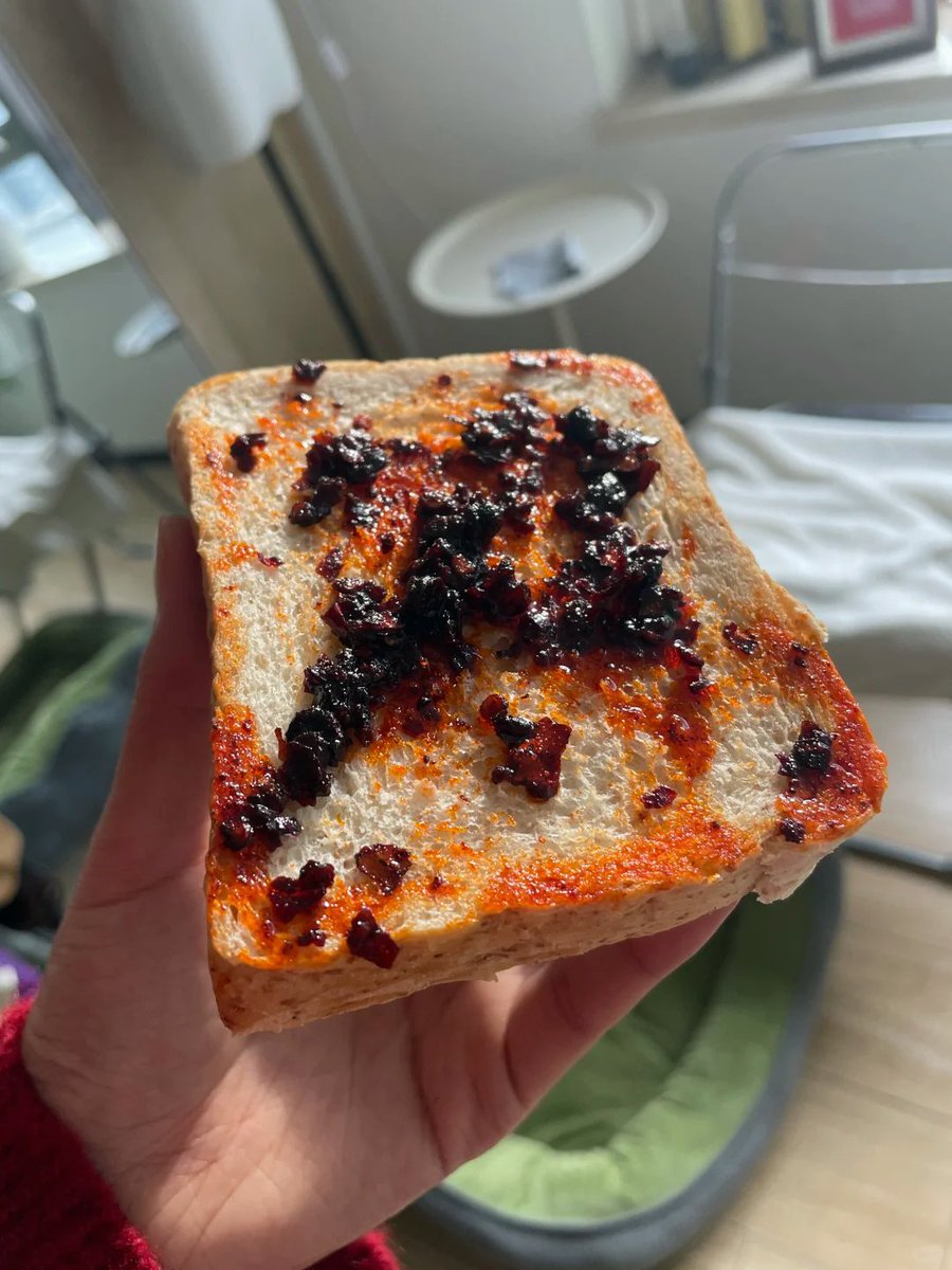 RhshdK2632's tweet image. Just slathered Lao Gan Ma on sourdough toast—game changer. This chili oil isn’t just for stir-fries; it’s a versatile flavor bomb. Curious how you use it! Drop your fave combo below. #PantryHero #UmamiBoost #TasteAdventure