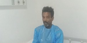 A retired U.S. Army officer is stuck in a Ghanaian hospital with medical bills exceeding $100,000. The U.S. Embassy states his stay was not official and declines responsibility. The hospital warns that discharging him could be fatal.