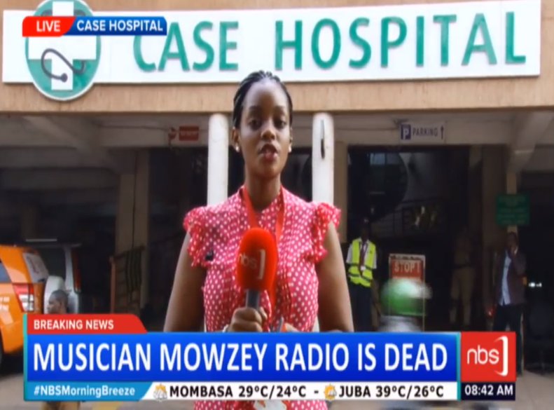 Picture 3: 
In a social media update at 8:49 AM on 1st February 2018, <a href="/TusiimeSheila/">Sheila Tusiime</a>, reporting live on <a href="/nbstv/">NBS Television</a> from Case Hospital, confirmed that singer Mowzey Radio had gone to the Lord.