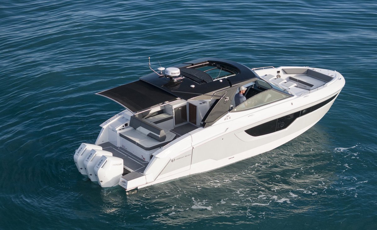 CruisersYachts's tweet photo. The 38 GLS OB is a sporty, agile day cruiser.  Powered by Mercury engines, the 38 glides across the water. And at the dock, or on the beach, she's loaded with  entertainment amenities. #sporty #daycruiser #handcrafterinamerica https://t.co/yyfkChlJHi