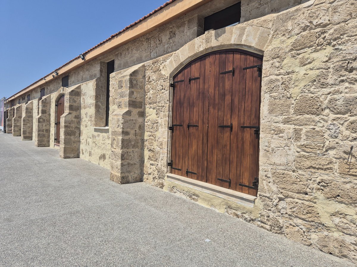 TheHistoryMouse's tweet photo. Doing a passable medieval impression. Paphos harbour. Door set in segmental arch. Look at those lovely buttresses though! #HeidiInPaphos #AdoorableThursday https://t.co/jlRNbQkcwi