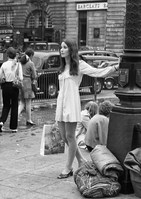 A Young Lady in London, 1969 🇬🇧

London in 1969 was a city alive with change, energy, and style—and this image of a young lady walking its streets captures that spirit perfectly. With fashion at the forefront of the cultural revolution, she reflects the confidence and