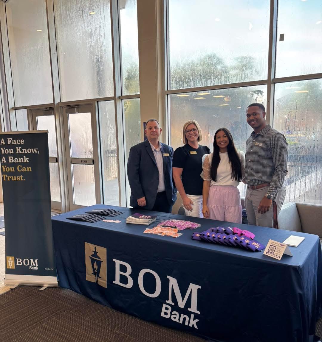 BOMest1903's tweet photo. Our BOM &amp; BOMFS team is out at the @NSULA Welcome Faculty Browse this morning! 💜🧡 We’re sharing all the perks of our Premium Checking account and handing out some fun promo items. Proud to be the Official Bank of NSU—fork ’em, Demons! 🤘 https://t.co/LAYojQf5fa