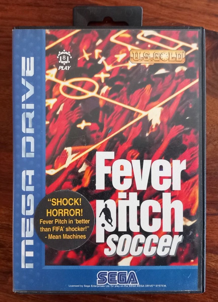 JoachimHesse's tweet photo. Mit dem Aufkleber „Shock! Horror! Fever Pitch in better than FIFA shocker!“ trägt #FeverPitchSoccer 1995 für #MegaDrive dick auf. 😱😂 In Deutschland kam das Fußballspiel übrigens als „#MarioBasler Fever Pitch Soccer“ auf den Markt. https://t.co/WmgItdIm84