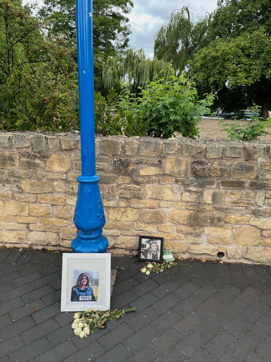 There is this little memorial in Stratford-upon-Avon, outside the Royal Shakespeare Company, for Shireen Abu Akleh who was killed by Israeli forces in 2022. It looks like a pilgrimage here, with the two photos. I hope this gave some solace to who brought it here.