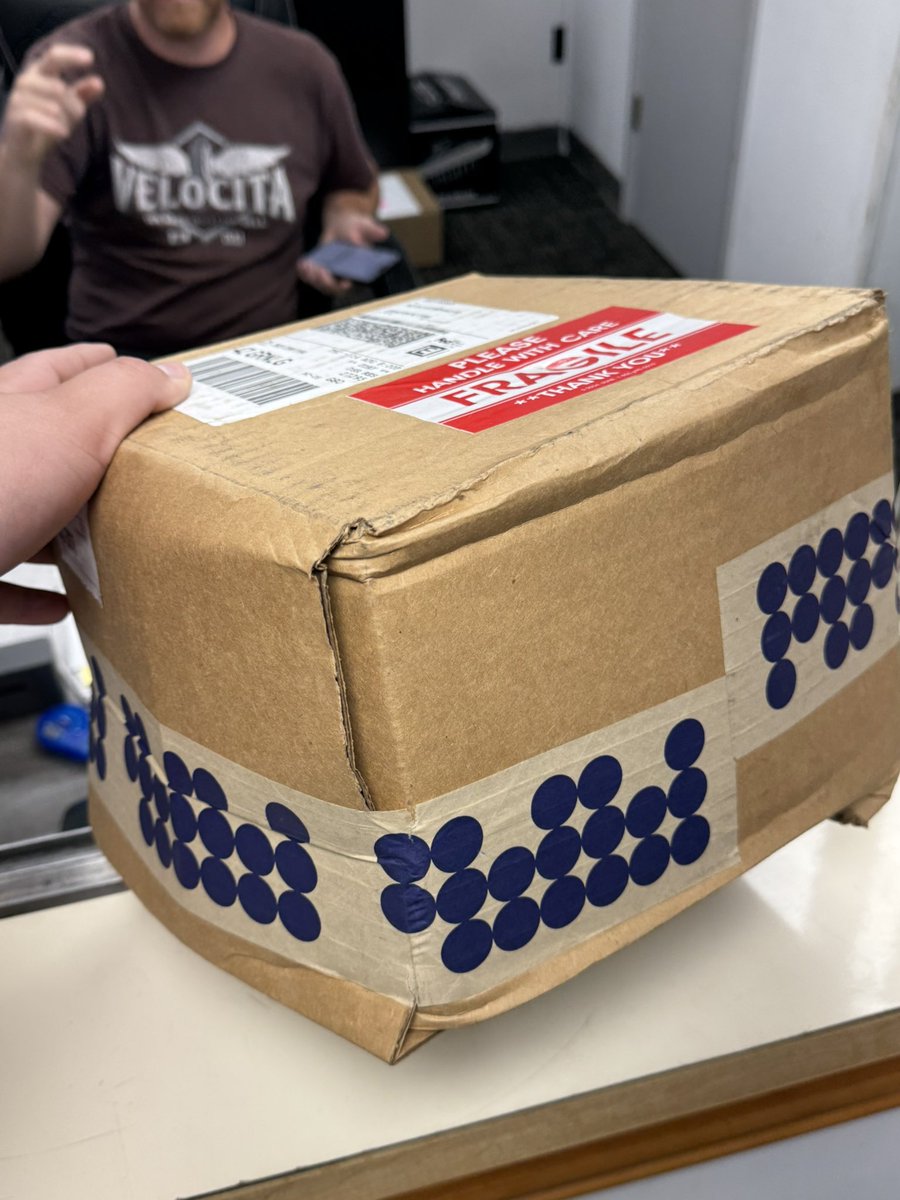 Erick_Messer's tweet photo. Hey @FedExHelp, you and I have some SERIOUS issues.

Is this seriously how you deliver your packages? A $1,400 camera lens with a fragile sticker? Are you joking???

And this is the THIRD TIME you’ve delivered a lens to me like this. Crushed and tossed. 

Completely unacceptable. https://t.co/cXvOYfsXl9