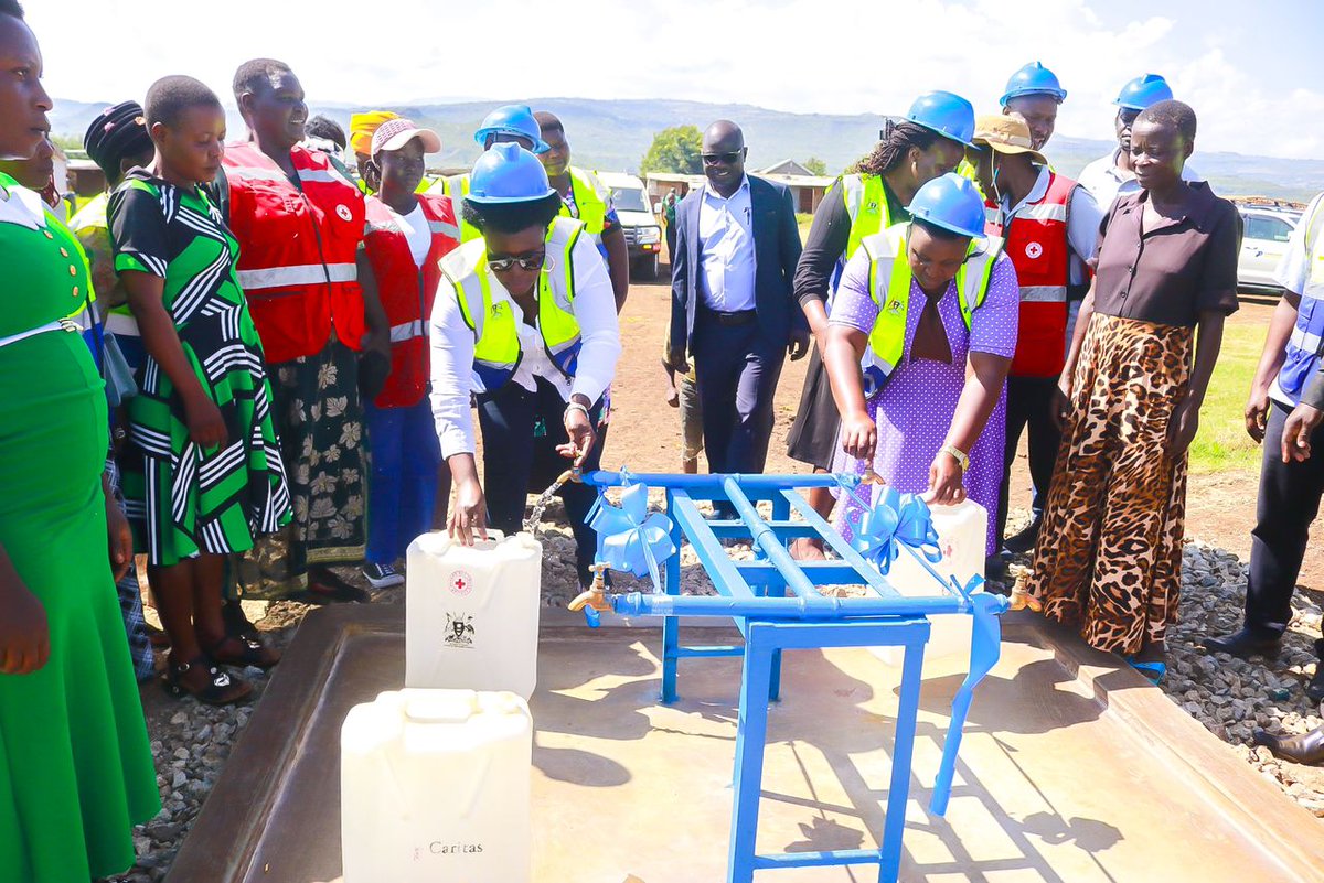 OPMUganda's tweet photo. Today, the Minister of State  for Relief, Disaster preparedness, and Refugees, Hon. Lillian Aber  has launched a water project at the Bunambutye Resettlement Camp in Bulambuli District. The project was established by the Texans and Ugandans on Mission (T&UM), a non-profit organization focused on community development and humanitarian interventions.