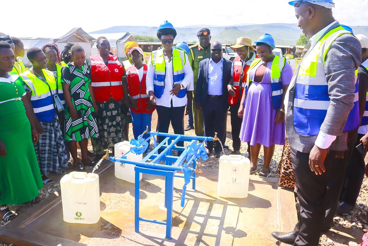 OPMUganda's tweet photo. Today, the Minister of State  for Relief, Disaster preparedness, and Refugees, Hon. Lillian Aber  has launched a water project at the Bunambutye Resettlement Camp in Bulambuli District. The project was established by the Texans and Ugandans on Mission (T&UM), a non-profit organization focused on community development and humanitarian interventions.