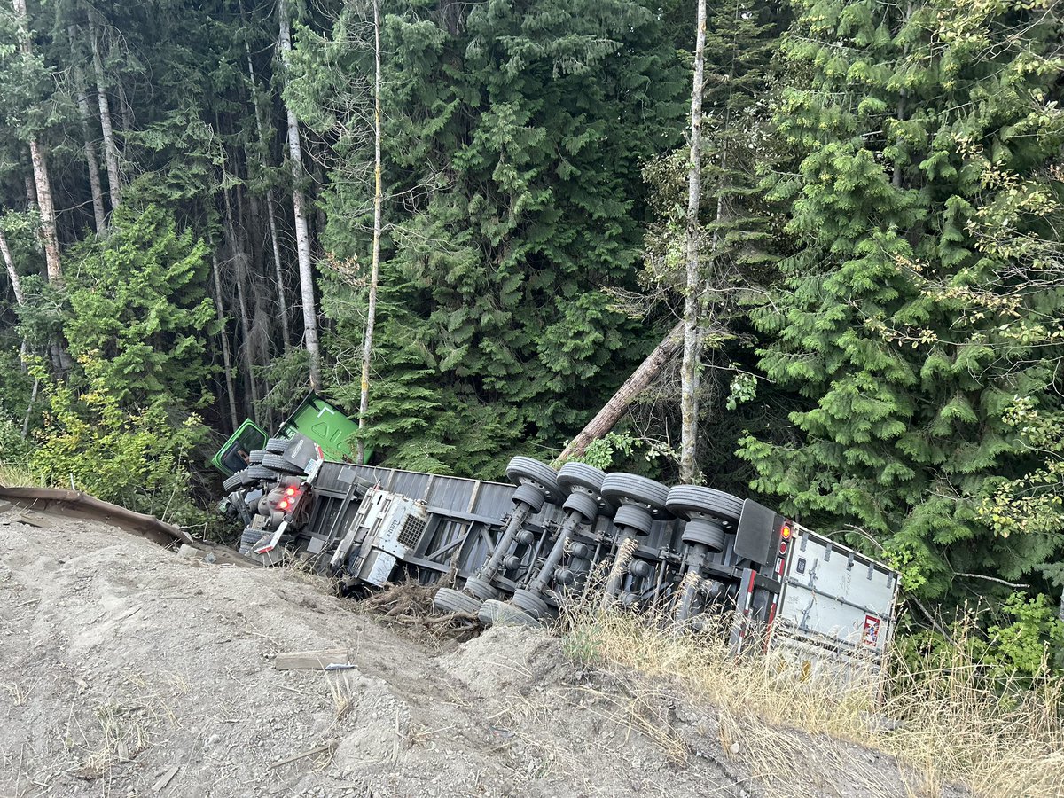 This semi drove through the guardrail this morning WB I-90, MP 68 on Easton Hill.  Driver was not injured.  This collision was the result of a blown tire.