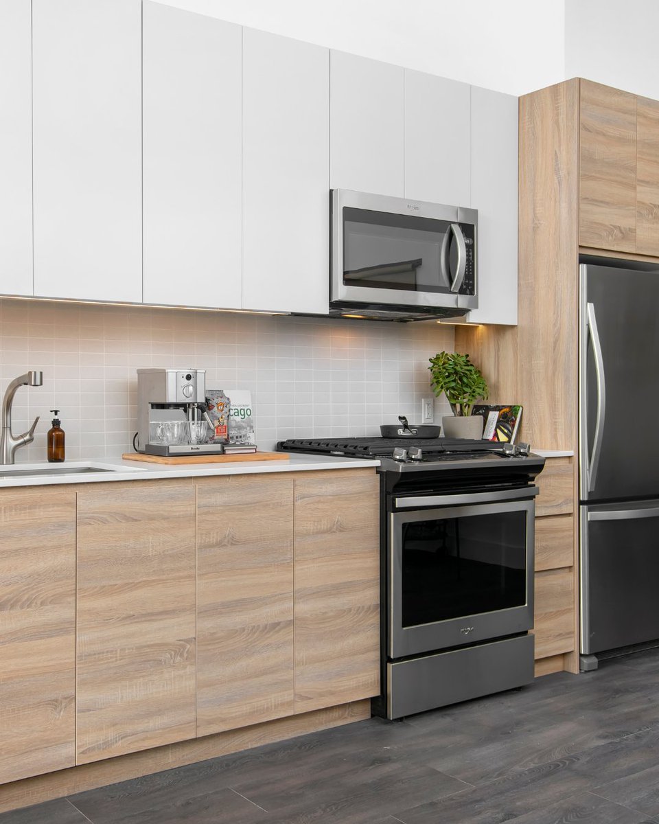 Your dream kitchen called and it’s got stainless-steel Whirlpool appliances, sleek tile backsplash, soft-close cabinets, and lighting that gets the vibe. 👩‍🍳