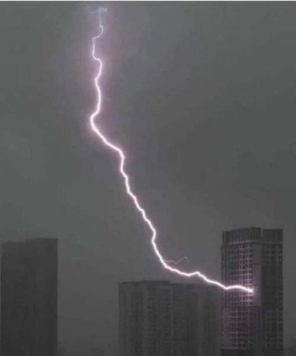Lightning striking a building, symbolizing high power usage of a Solana node