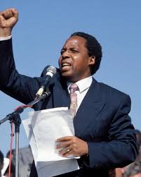 Assassination Tape 6 — Chris Hani (1993, South Africa)

April 10, 1993 
One bullet to the head, in his driveway, in front of his daughter.
Chris Hani’s death almost lit the fuse to civil war.
They aimed to silence the future.
Instead, they ignited a nation’s demand for change.