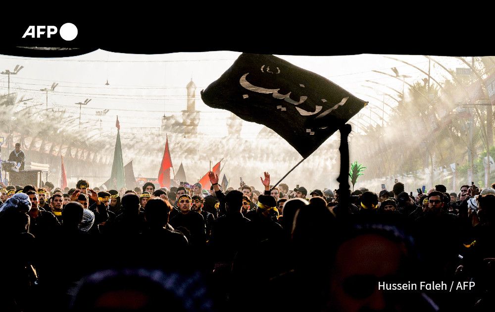AFP's Hussein Faleh photographs Shiite Muslim devotees reaching to receive a blessing from the tomb of Imam Hussein, the Prophet Mohammed's grandson, in Iraq's central holy city of Karbala ahead of the Arbaeen religious festival commemorating his seventh century killing