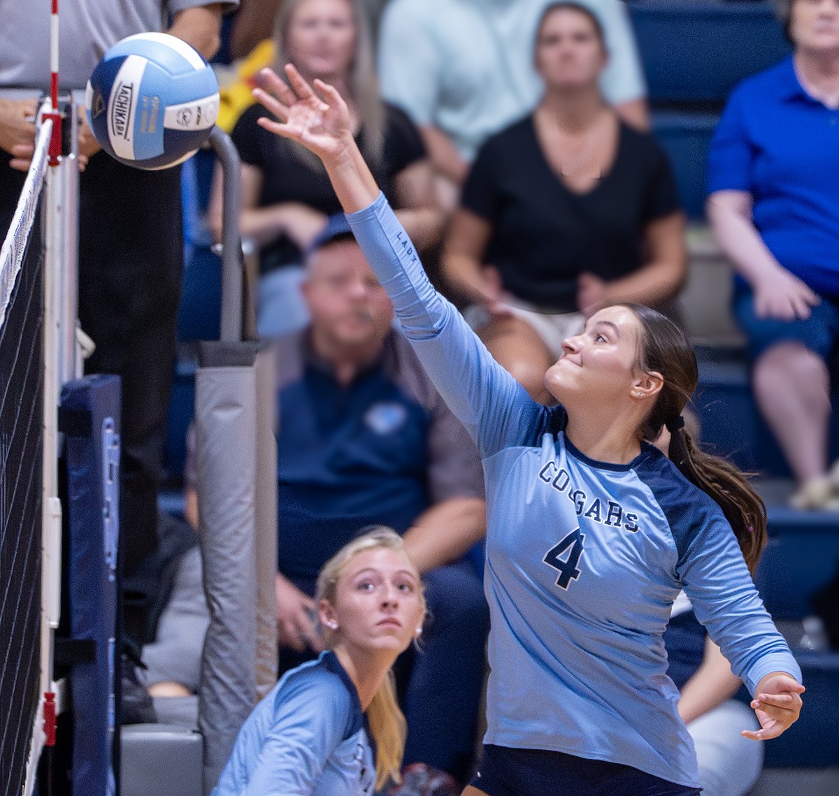 Senior Kaydence Watkins flips the volleyball over the net during South Brunswick’s home opener Aug. 14, 2025. Two nights earlier the Cougars played their first match of the season, against West Brunswick, and won in four sets.