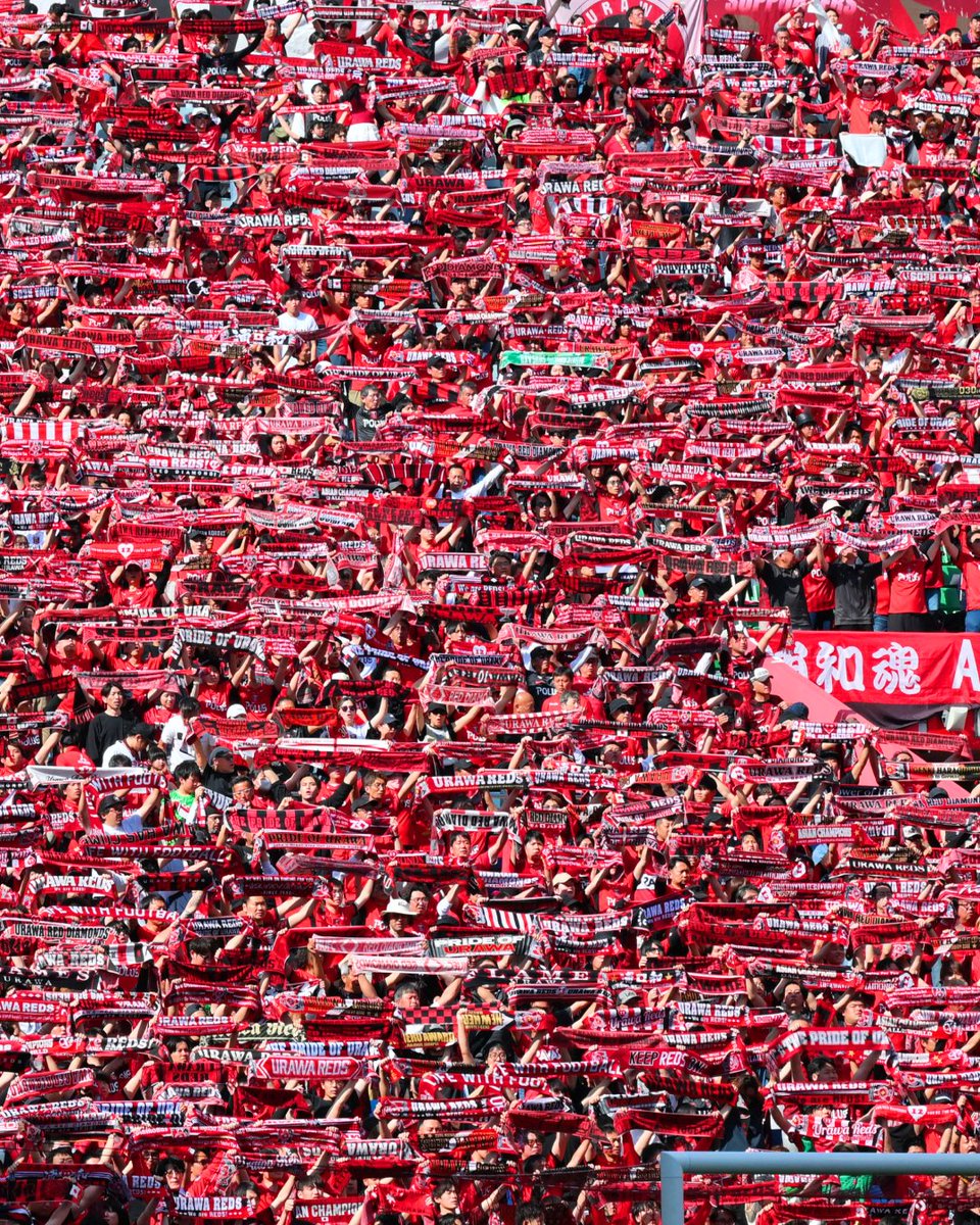 J_League_En's tweet photo. The appeal of J.League is not just about the players.
Just like the battles fought on the pitch, the passion of the supporters is also one of the league’s biggest charms🔥
This time, we introduce the supporters of the Urawa Reds♦️

The Urawa Reds are one of the clubs with the largest number of supporters and highest attendance in J.League. Their average home game attendance is among the top in the league, and statistics show they also have the highest total attendance in J.League history👏

The stadium-wide red “choreography” and the powerful chants that push the players forward are truly breathtaking. Their passion and style have even caught the attention of international media👀

Supporting the Urawa Reds are supporters who are often called the “12th player,” carrying pride and passion in their hearts🔴
Their presence, shared with Japan and the world, is a defining scene of J.League.

Tomorrow is a home game against Nagoya Grampus. 
All eyes will be on the Urawa Reds as they fight with the loud and passionate support of their many supporters!

#JLEAGUE
#football
#urawareds