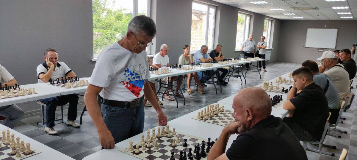 Peter Heine Nielsen (@phchess) on Twitter photo Russian 🇷🇺 organised chess simul, in illegally occupied parts of Ukraine 🇺🇦.
Russian IM wearing a Russia 🇷🇺 shirt.
<a href="/FIDE_chess/">International Chess Federation</a> has an obligation to stop this illegal use of chess for politics.
<a href="/advorkovich/">Arkady Dvorkovich</a>
<a href="/DanaReiznieceOz/">Dana Reizniece-Ozola</a>
<a href="/lukaszturlej/">Lukasz Turlej</a>
<a href="/EmilSutovsky/">Emilchess</a>
<a href="/ECUonline/">European Chess Union</a> Russian 🇷🇺 organised chess simul, in illegally occupied parts of Ukraine 🇺🇦.
Russian IM wearing a Russia 🇷🇺 shirt.
<a href="/FIDE_chess/">International Chess Federation</a> has an obligation to stop this illegal use of chess for politics.
<a href="/advorkovich/">Arkady Dvorkovich</a>
<a href="/DanaReiznieceOz/">Dana Reizniece-Ozola</a>
<a href="/lukaszturlej/">Lukasz Turlej</a>
<a href="/EmilSutovsky/">Emilchess</a>
<a href="/ECUonline/">European Chess Union</a>