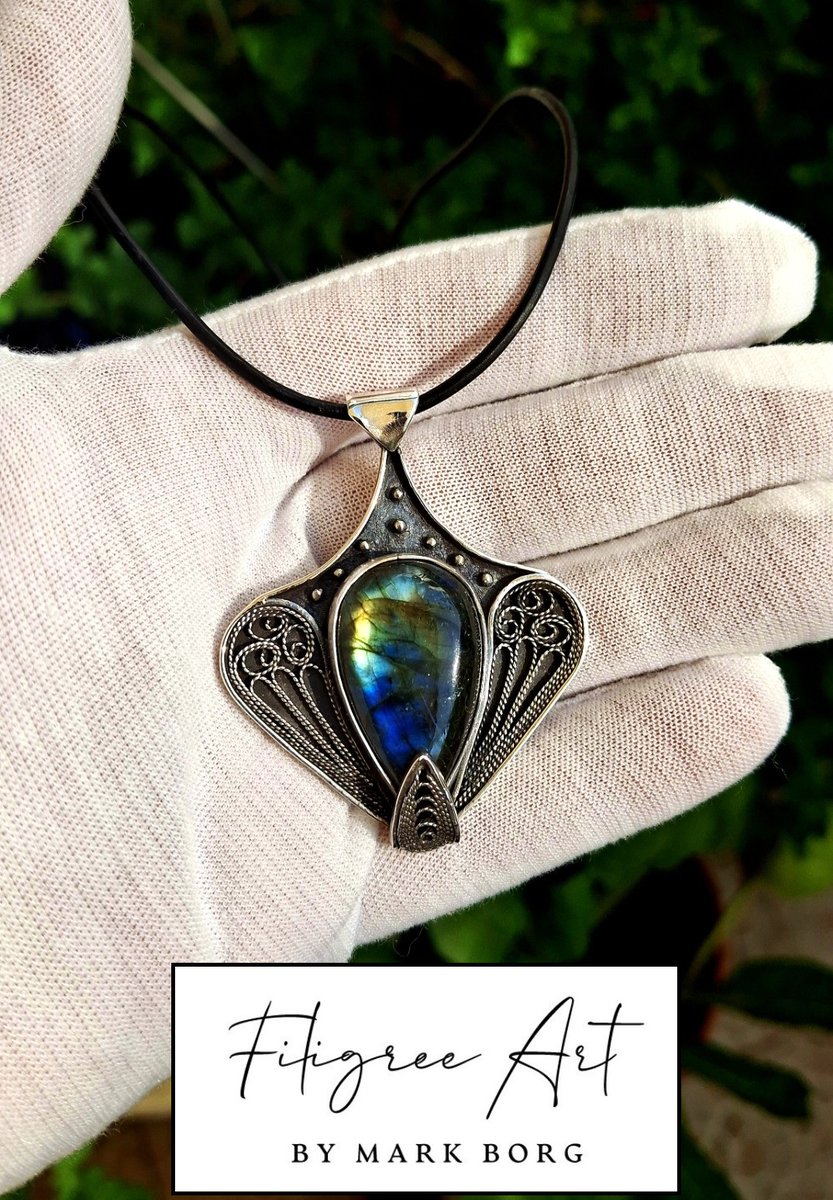✨ Peacock’s Whisper ✨
Handcrafted in sterling silver filigree, this pendant captures the mesmerizing blues, greens, and golds of a peacock’s plumage — brought to life by the natural magic of labradorite.

Available now – message me to make it yours.

#FiligreeArt #MarkBorg