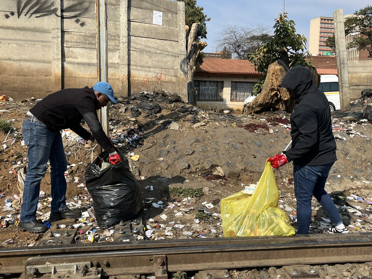 GDCoGTA's tweet photo. [IN PICTURES] : We are now in the railway line , our aim is to keep the railway line clean , as part of our CBD revitalisation. The railway line requires machinery but it will start with us. #CBDFriday #SpanaMaspala #GrowingGautengTogether https://t.co/J9d8UOiSmg