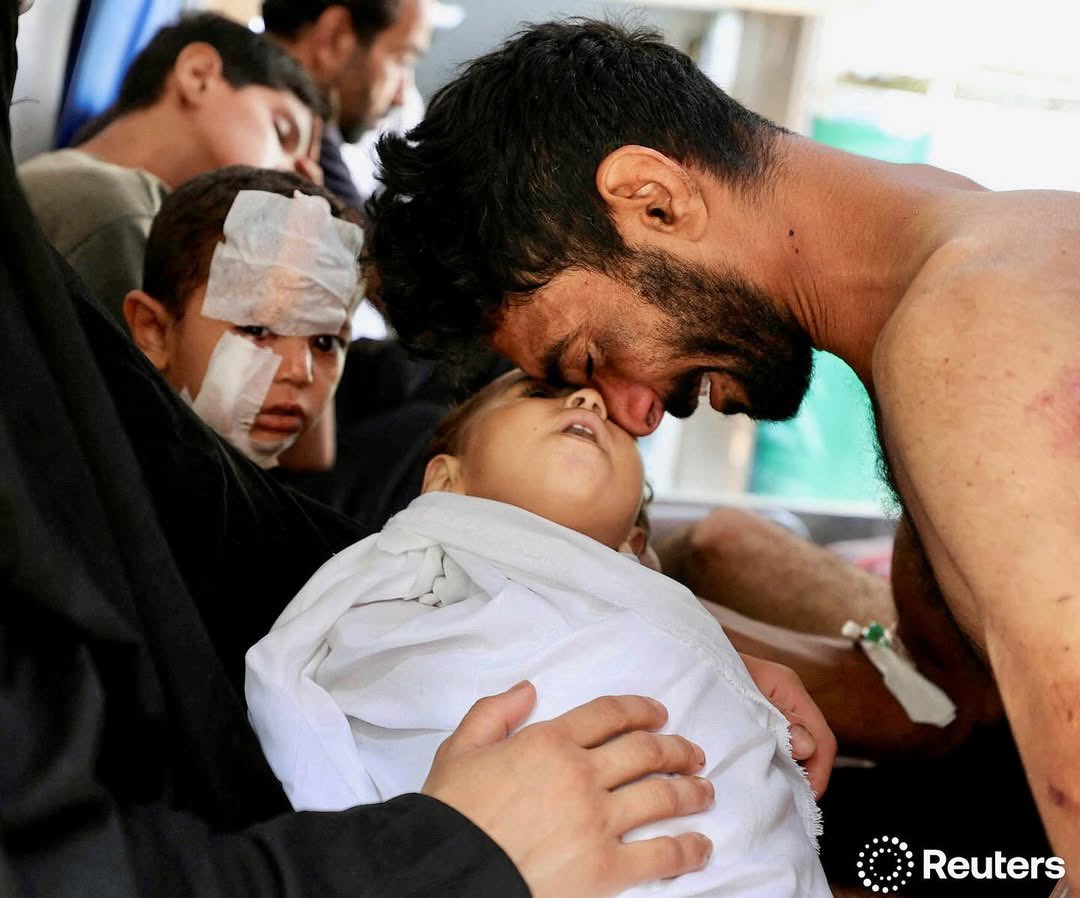 A Palestinian man mourns the death of his son, Kanan Bakr, killed in an early morning Israeli strike on a tent, according to medics, in Gaza City, August 15, 2025.