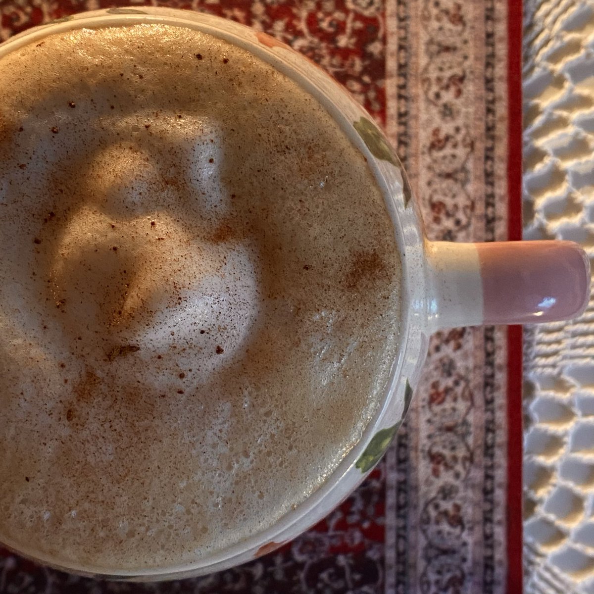 coffee with frothed milk, cinnamon and vanilla sugar