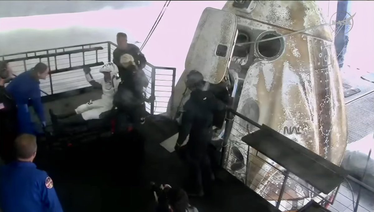 Crew-10 is home. In this photo, NASA Flight Surgeon Dr. Moriah Thompson (UTMB RAM ’19, far left) stands ready to support Anne McClain after Dragon egress on the recovery ship. Early care targets vestibular re-adaptation, hemodynamics, orthostasis, and coordination.