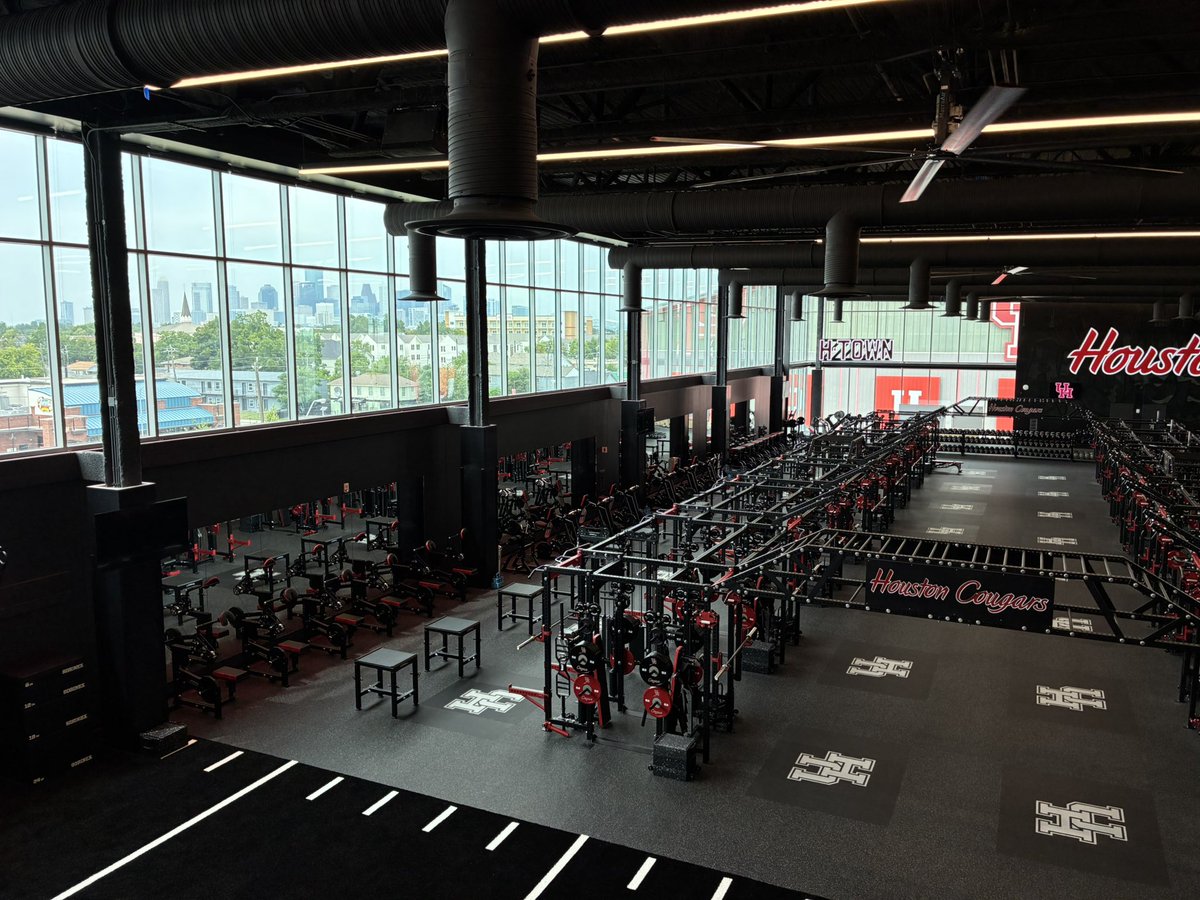 Downtown Houston skyline visible from inside Houston weight room 

<a href="/UHCougarFB/">Houston Football</a>