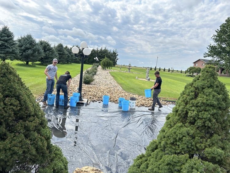 Football players took a break from football today and helped move some rock. Unreal work ethic from these boys!