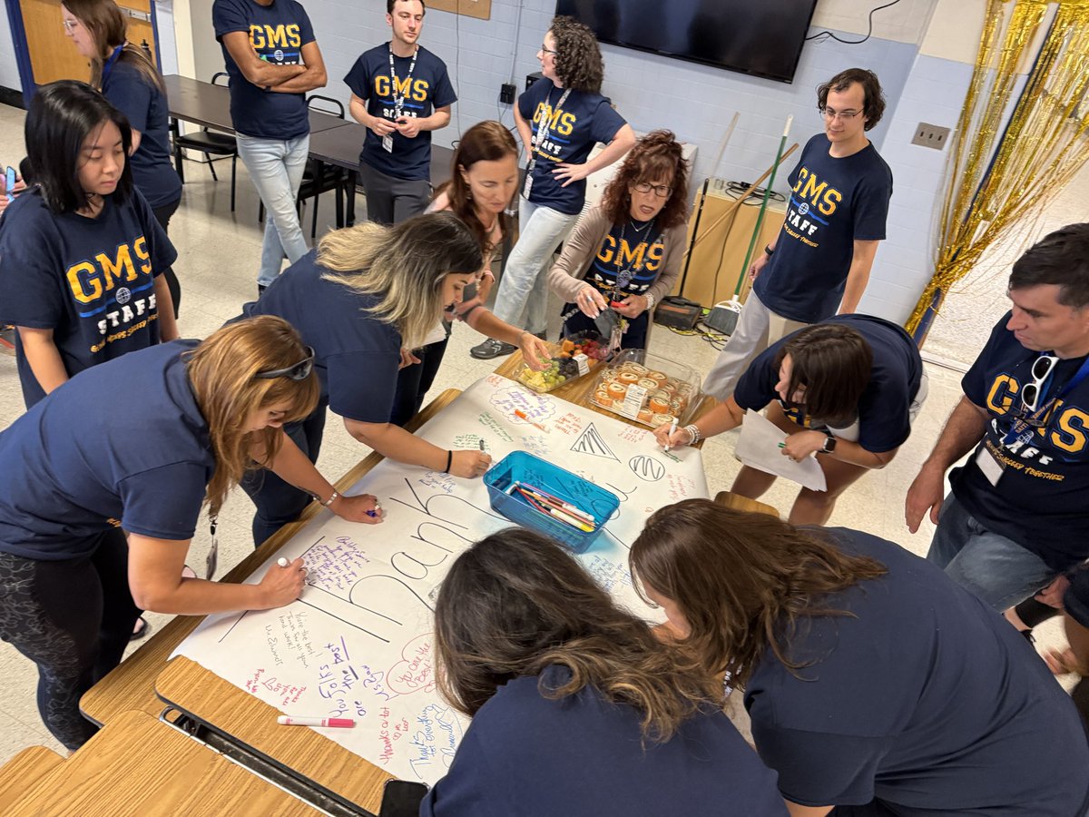 Teachers showing big love 💛💙 Signing a giant thank-you card for our incredible building service team. The heart of GMS beats stronger because of you! #GlobalMindsSucceed #ThankYouTeam