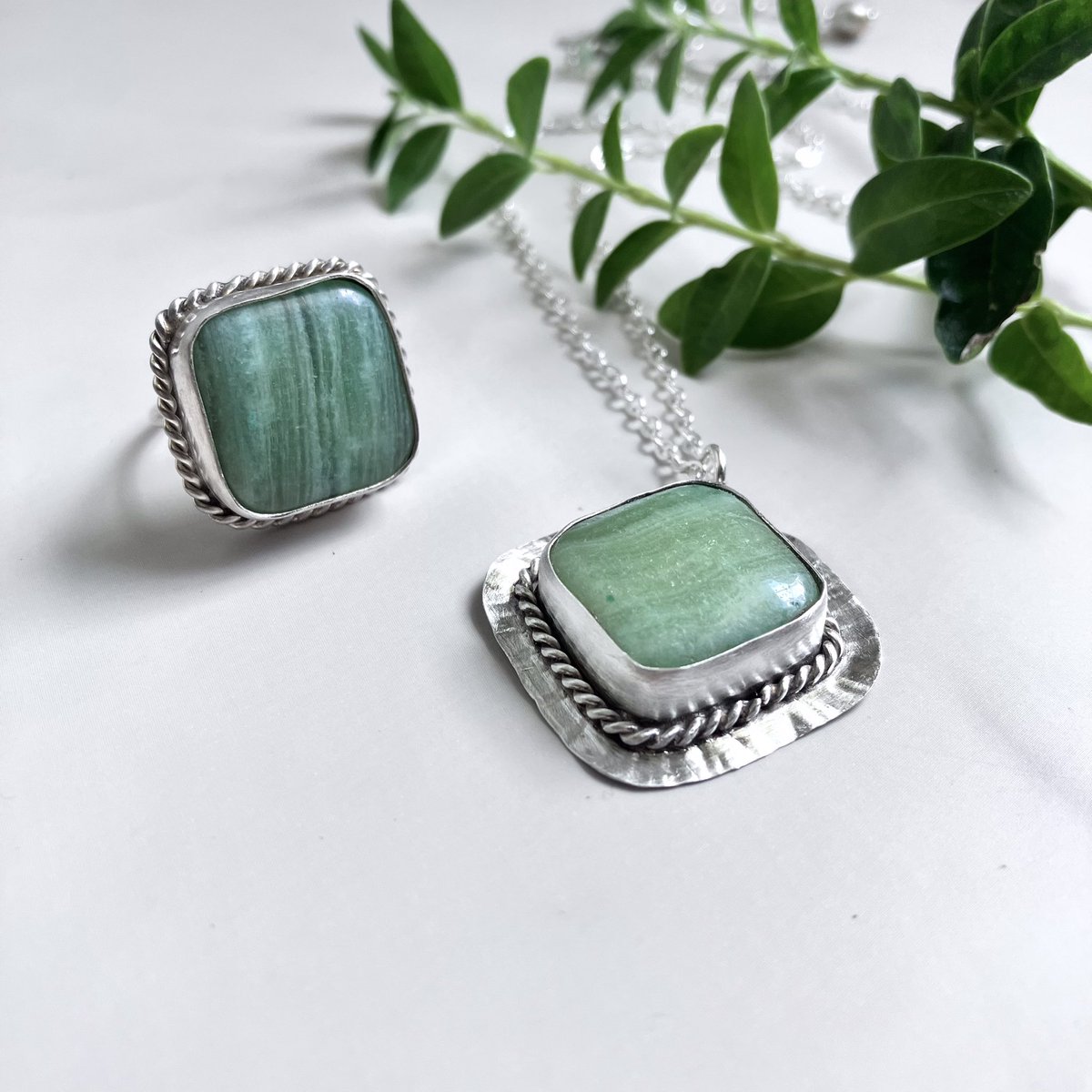 This is “The Elena Necklace”.  Chrysoprase gemstone with petite green chalcedony accents and a pearl adornment on the extender chain.  Both necklace and ring are part of the “Free Spirit” Collection.

bellarosejewelrydesign.com/product-catego…