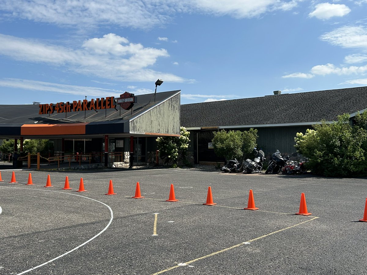 mgoblue85's tweet photo. Apparently, someone took a trip through Zips on Monday. The black tarp covers the impact location. Thankfully it was after they closed for the day. The owner says the vehicle was going over 60mph when it hit the building. Yikes 😬 #GaylordMichigan #45thParallel #HarleyDavidson https://t.co/0eDqFLKVBD