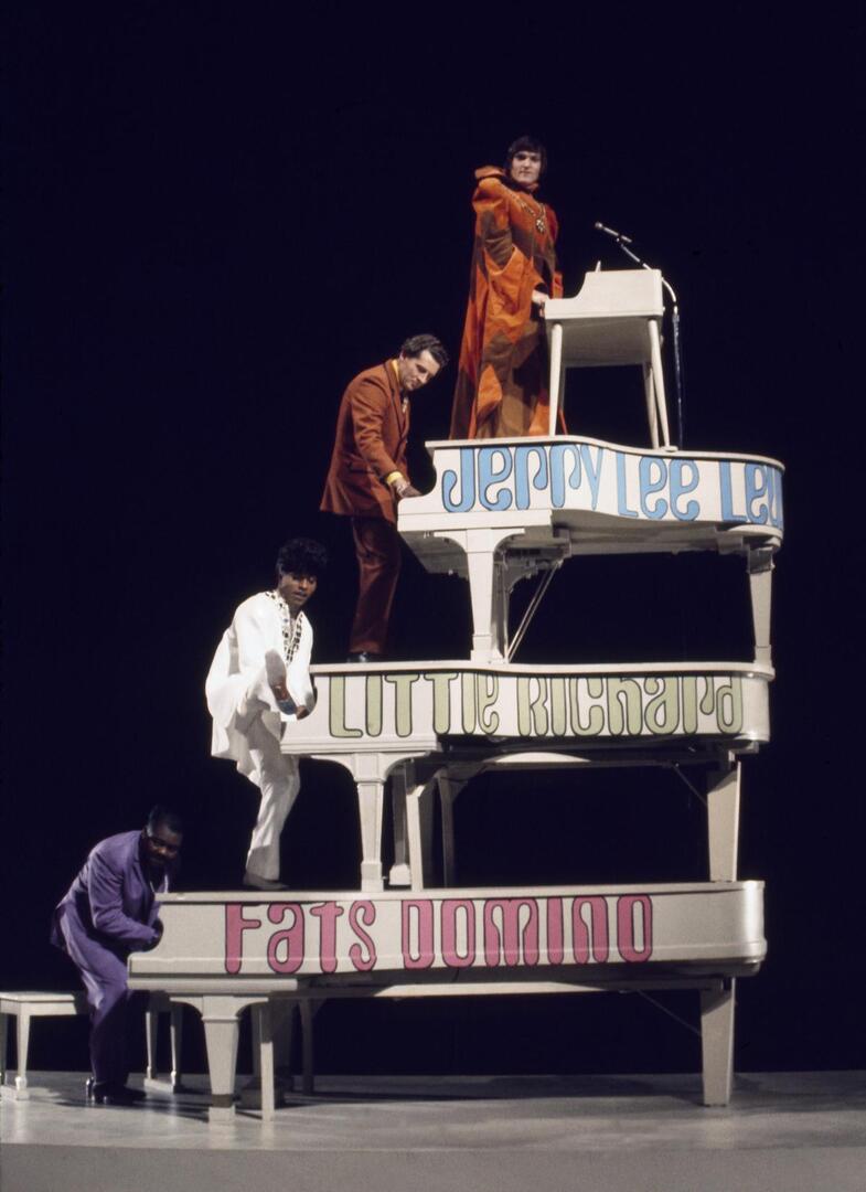 In a memorable moment from The Monkees TV special 33⅓ Revolutions Per Monkee (1969), Fats Domino, Little Richard, Jerry Lee Lewis, and Brian Auger pose with their pianos stacked up. Brian attests that these shots were candid and not staged.